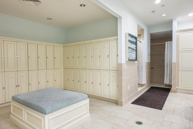 interior space featuring recessed lighting, visible vents, and curtained shower