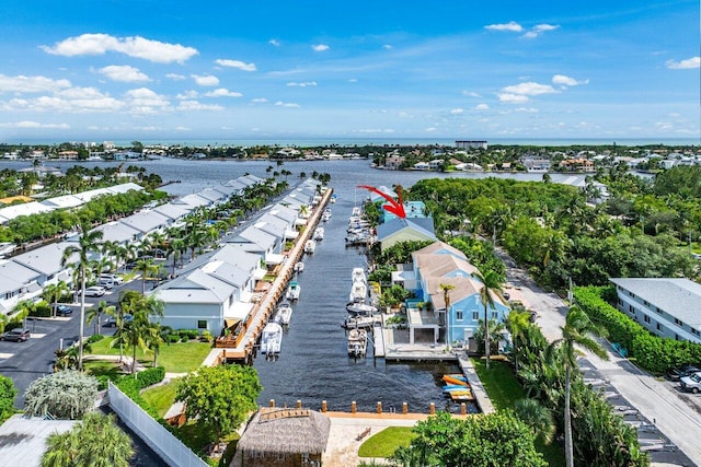 birds eye view of property with a water view