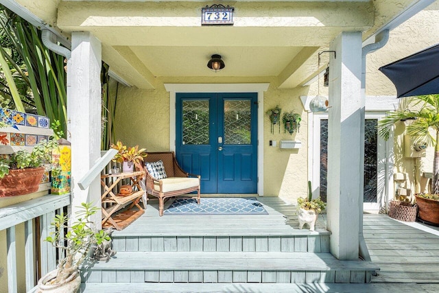 property entrance with french doors and covered porch