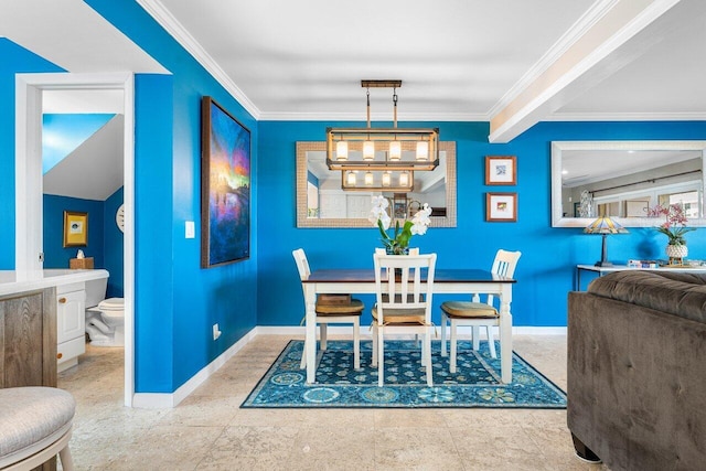 dining space featuring crown molding and a notable chandelier