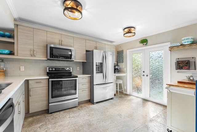 kitchen with crown molding, backsplash, appliances with stainless steel finishes, and french doors