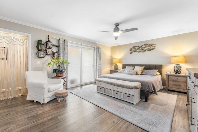 bedroom with access to exterior, wood-type flooring, ceiling fan, and crown molding