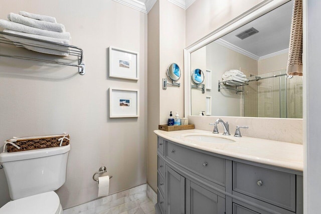 bathroom with vanity, toilet, and crown molding