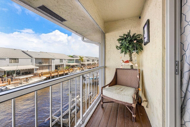 balcony featuring a water view