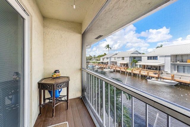 balcony featuring a water view