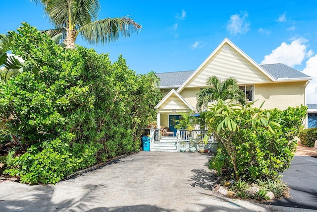 obstructed view of property with covered porch