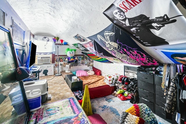 interior space featuring carpet, a textured ceiling, and vaulted ceiling