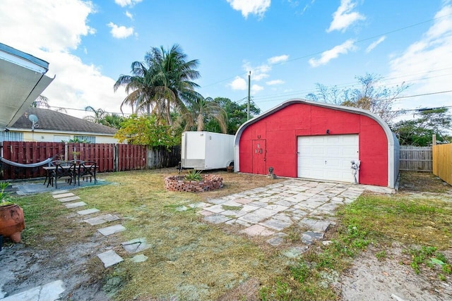 garage with a lawn