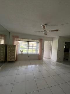 spare room featuring light tile patterned flooring