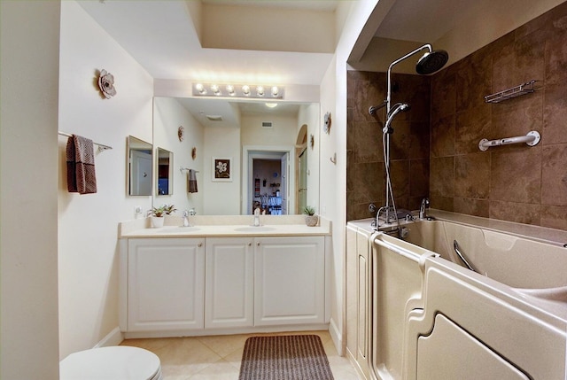 full bathroom featuring toilet, tile patterned flooring, vanity, and tiled shower / bath