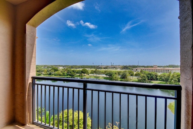 balcony featuring a water view