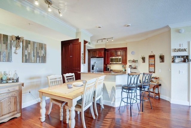 dining space featuring dark hardwood / wood-style floors and ornamental molding