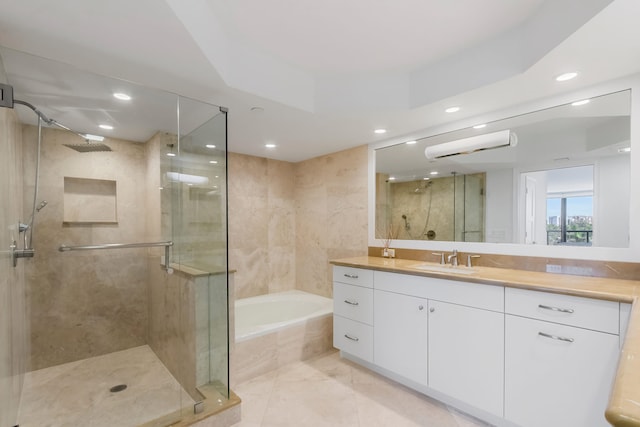 bathroom with vanity and independent shower and bath