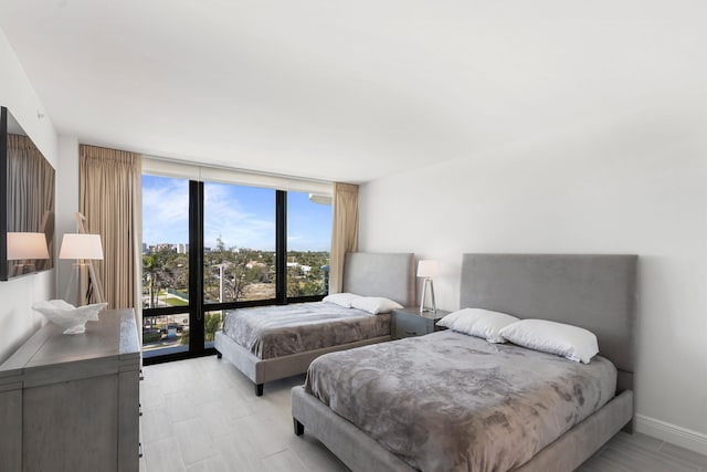 bedroom featuring a wall of windows