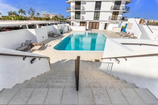 view of pool featuring a patio