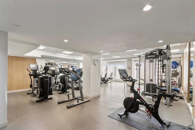 workout area featuring wooden walls