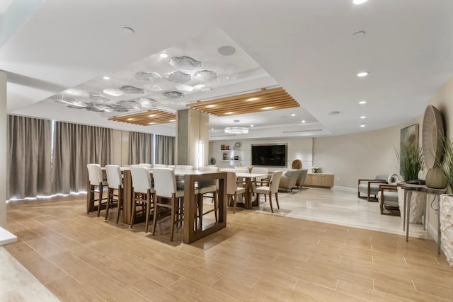 dining area with a tray ceiling