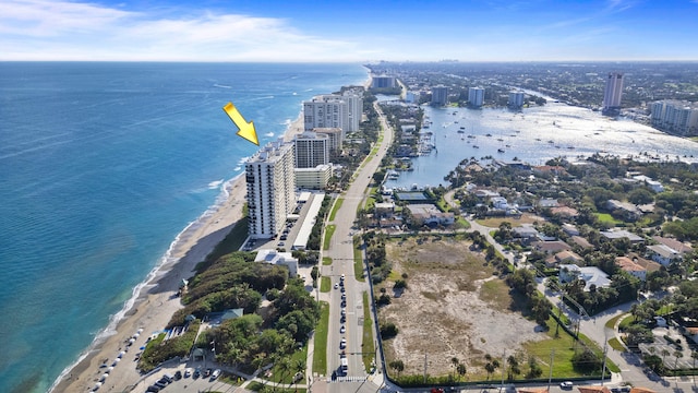 bird's eye view with a water view and a view of the beach