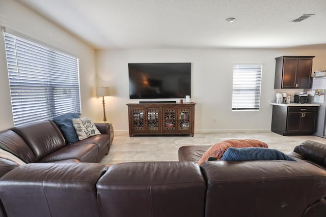 living room featuring light tile patterned flooring