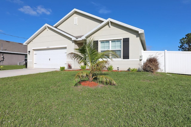 view of front facade with a front yard and a garage