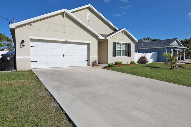 ranch-style home with a garage and a front yard