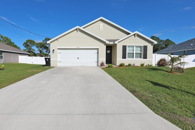 view of front of home featuring a front yard and a garage