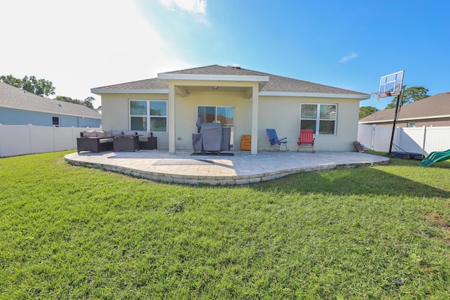 rear view of property with a lawn, a patio, and an outdoor hangout area