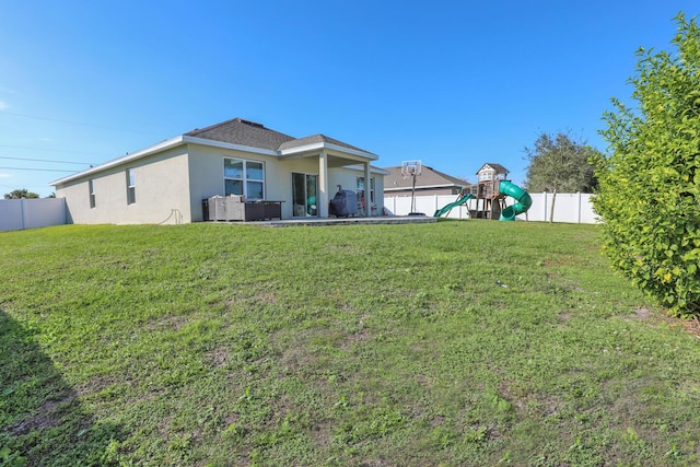 view of yard featuring outdoor lounge area and a playground