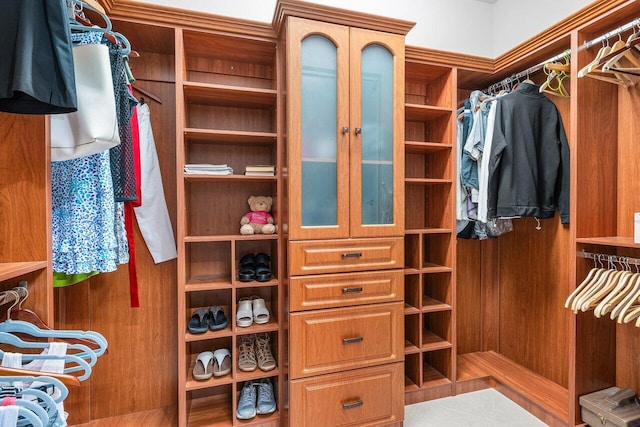 walk in closet featuring tile patterned flooring