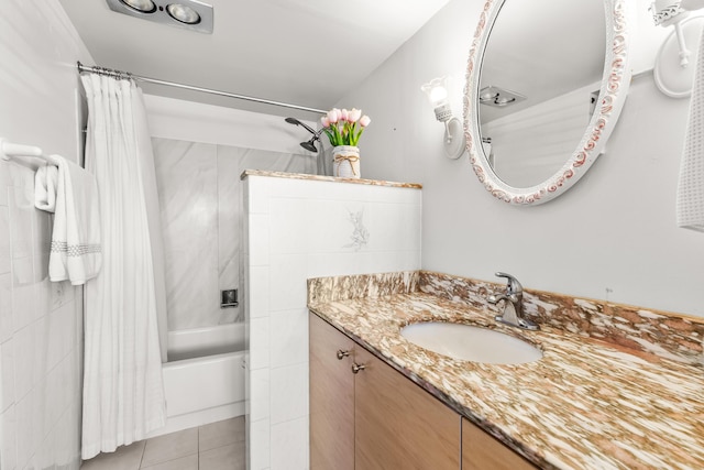 bathroom with tile patterned floors, vanity, and shower / bath combination with curtain