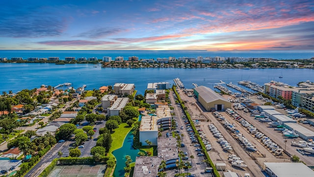 aerial view at dusk with a water view