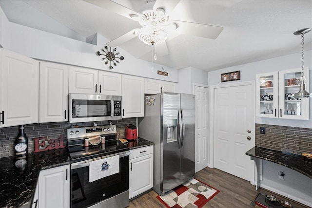 kitchen with white cabinetry, decorative backsplash, and appliances with stainless steel finishes