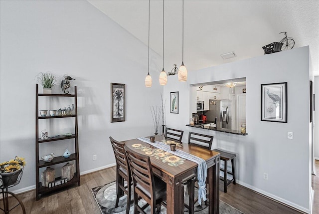 dining area featuring dark hardwood / wood-style flooring