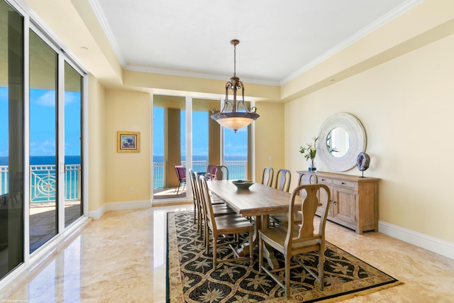 dining room with a wealth of natural light, a water view, and ornamental molding