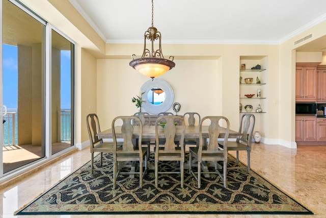 dining area featuring built in shelves and ornamental molding