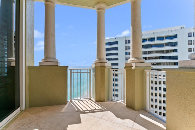 balcony featuring a water view