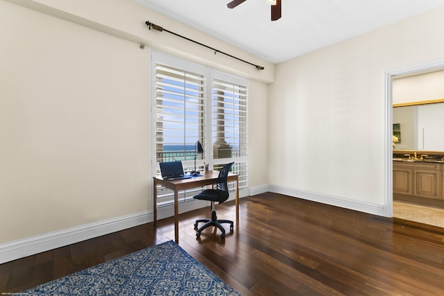 office area with ceiling fan and dark hardwood / wood-style flooring