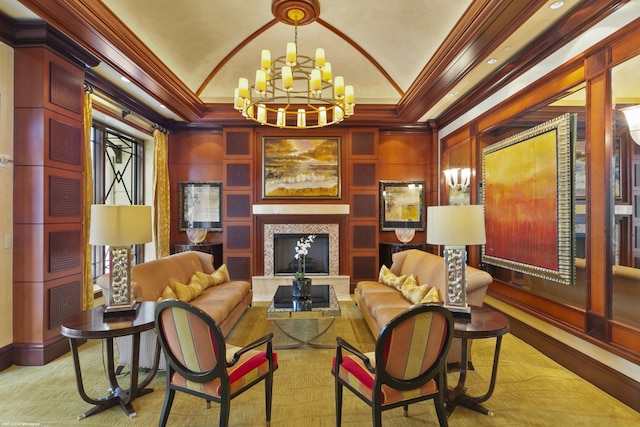 sitting room with lofted ceiling, crown molding, and a notable chandelier