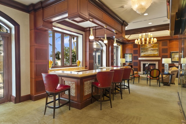 bar with decorative light fixtures, crown molding, and light colored carpet