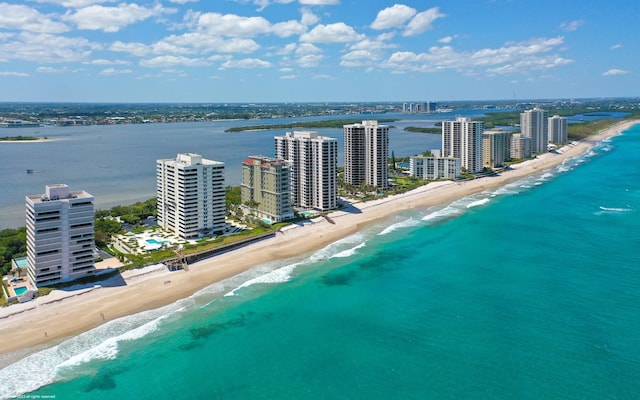 bird's eye view with a view of the beach and a water view