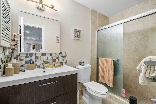 bathroom with decorative backsplash, toilet, walk in shower, and vanity