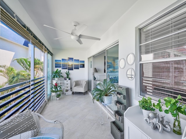 sunroom featuring ceiling fan