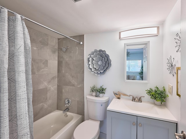 full bathroom featuring vanity, toilet, and shower / bath combo with shower curtain