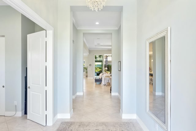 hall featuring a notable chandelier and light tile patterned flooring