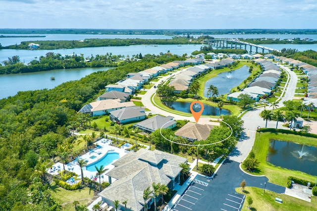 birds eye view of property featuring a water view