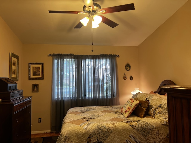 bedroom featuring lofted ceiling and ceiling fan