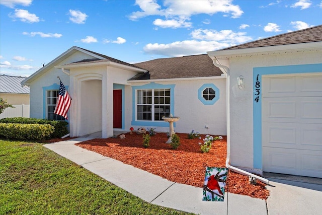 ranch-style home featuring a garage