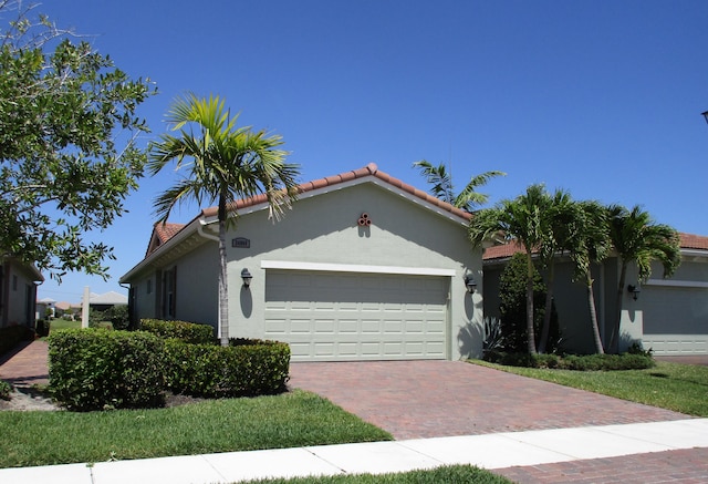 mediterranean / spanish house featuring a garage