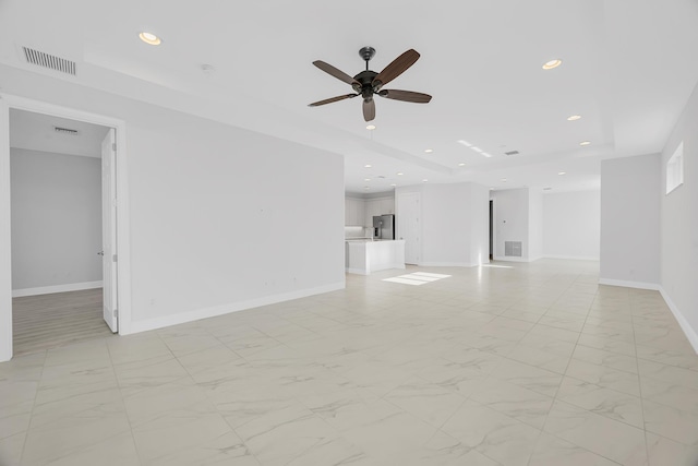 unfurnished living room featuring ceiling fan