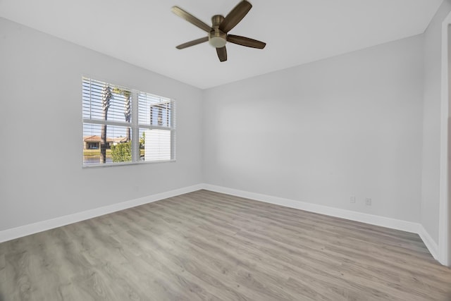 empty room featuring light hardwood / wood-style floors and ceiling fan